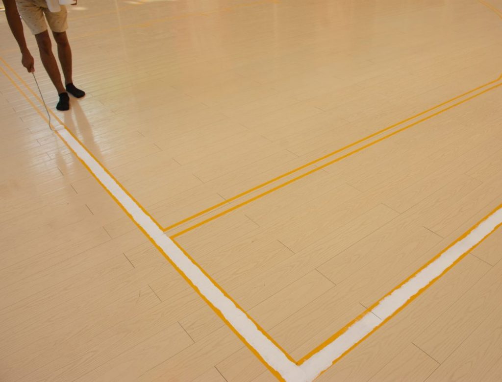 Basketball court Macwood sports floor brush ink to draw a white line