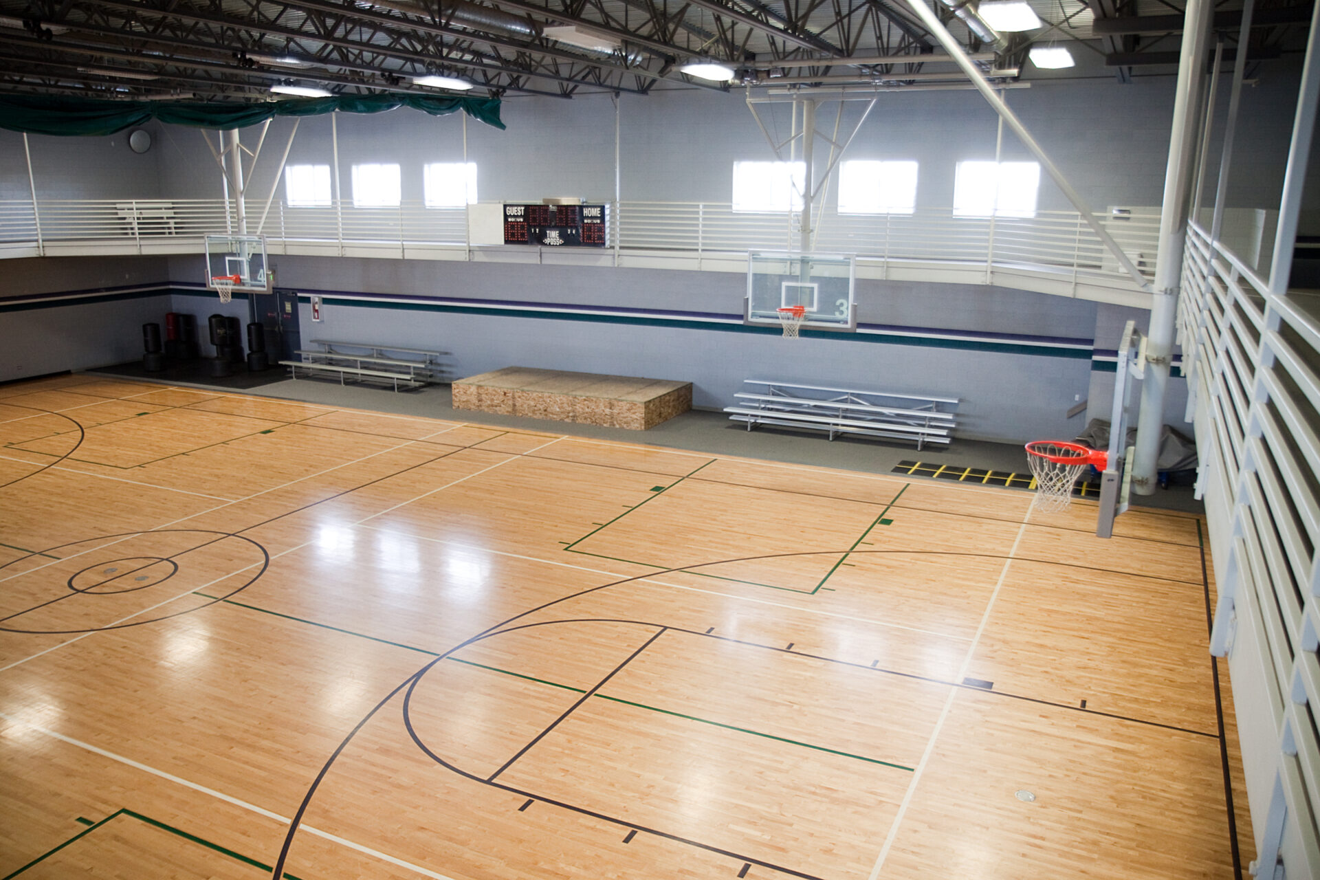 Empty basketball court in a gymnasium.
